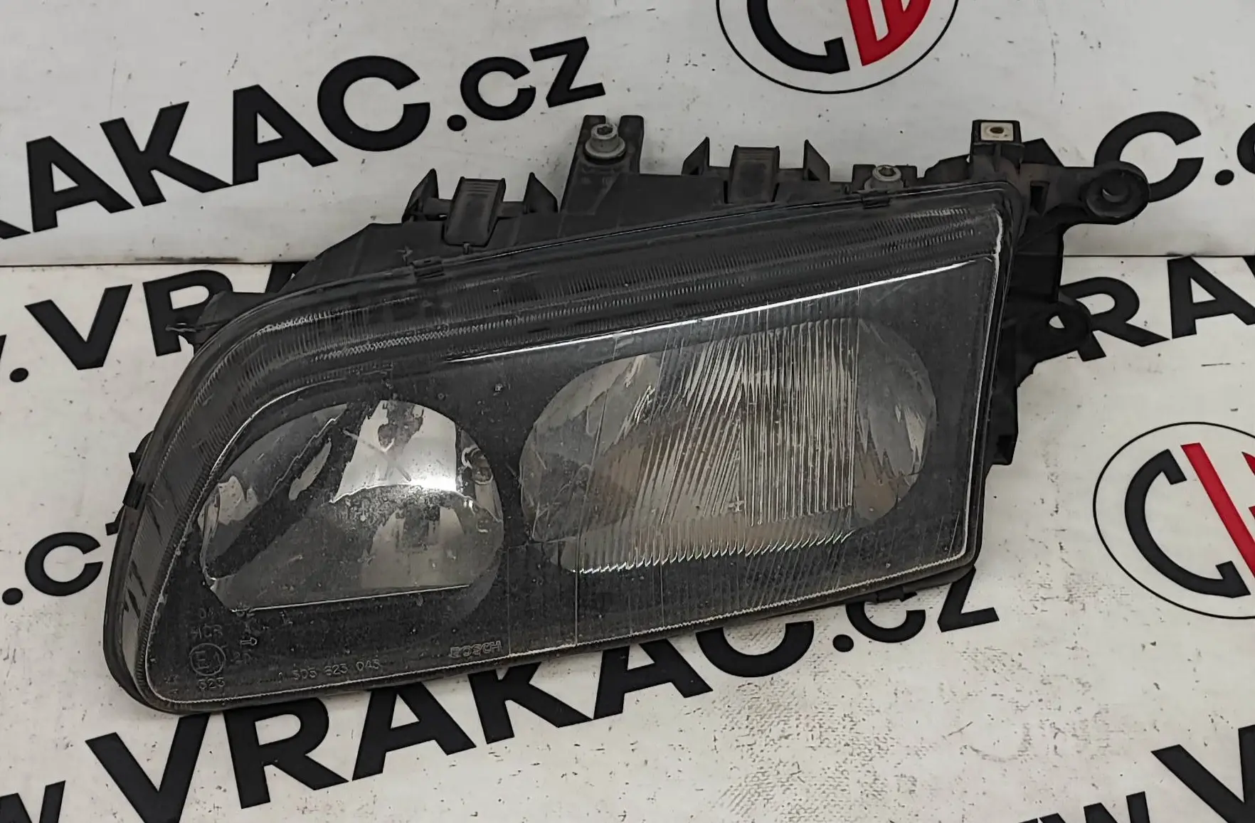 Světlomet levý přední – Mazda 626 1997-2002